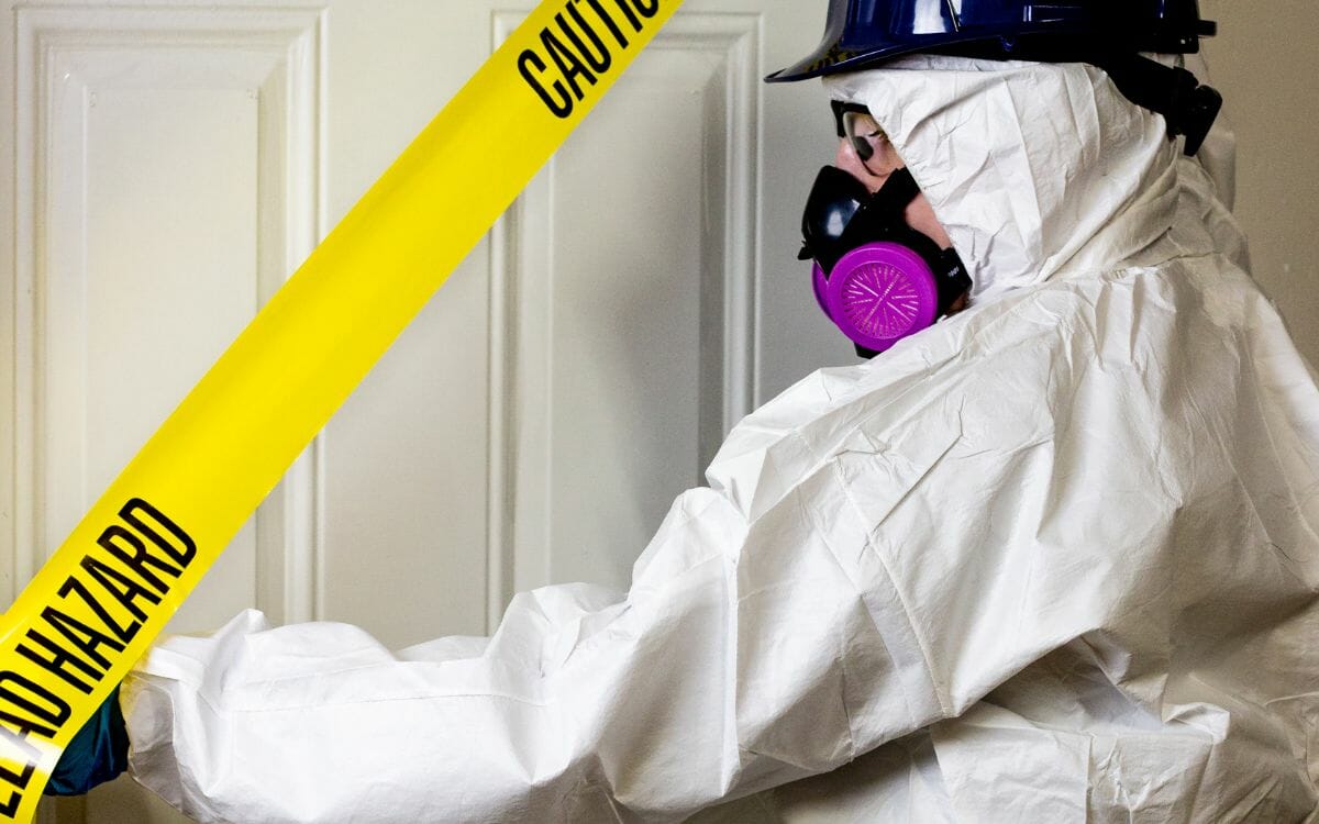 A professional asbestos abatement specialist from Desa Contracting and Restoration is currently working at a condominium in Toronto.