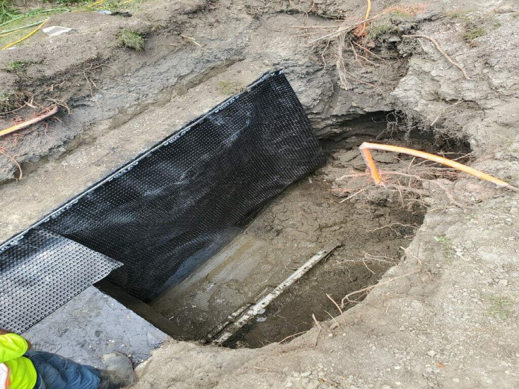 Showing a waterproof filter that Desa Contracting, Restoration and Janitorial Services in Toronto installed underground in a home's backyard.
