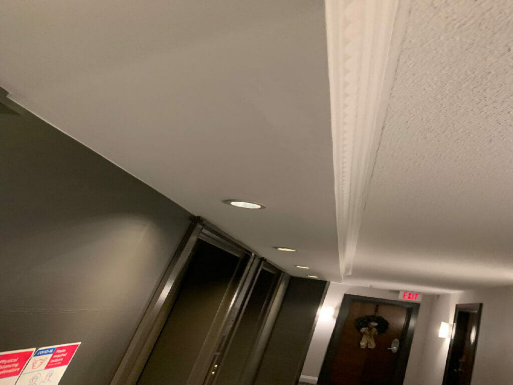 Desa Contracting, Restoration and Janitorial Services is displaying the LED-lit renovated ceiling and updated doors at Rean Hallway,Toronto.