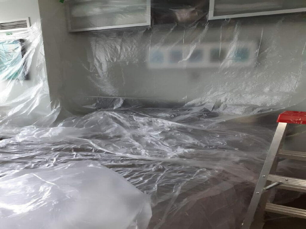 In order for Desa Contracting, Restoration, and Janitorial Services to do water damage restoration, a room of a house in Toronto was covered with a polyethylene translucent sheet.