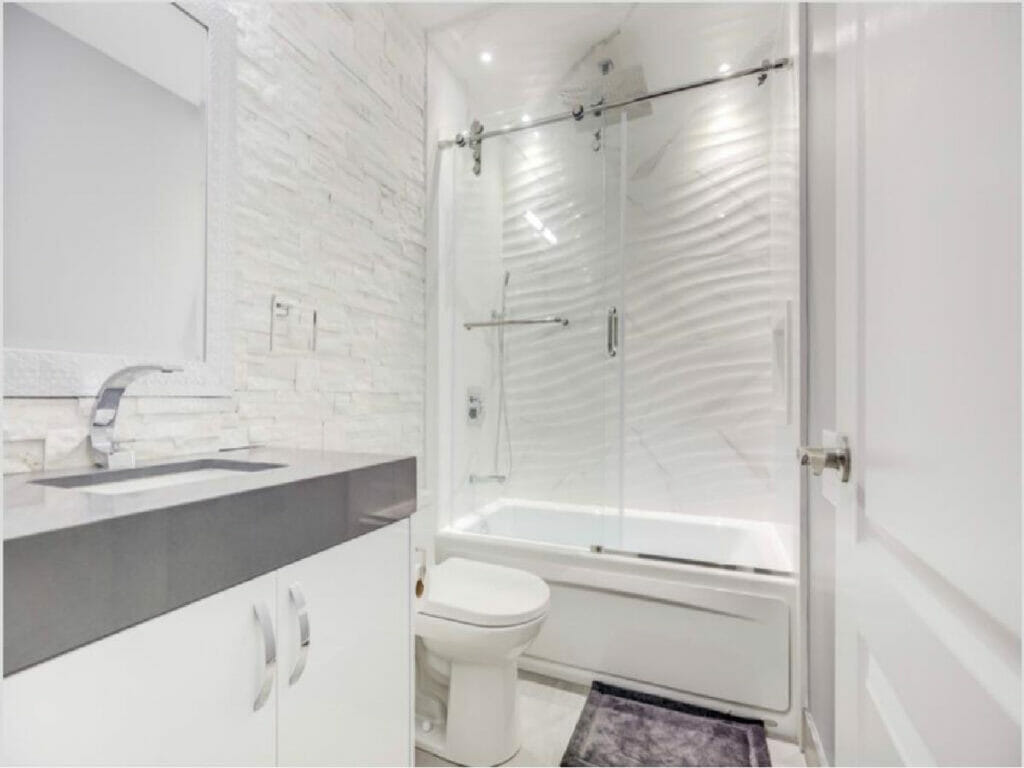 Desa Contracting and Repair, based in Toronto, offers comprehensive house repair services that encompass various essential elements. Their expertise includes installing a mirror, a beautiful sink, a toilet, and a standalone bathing area.