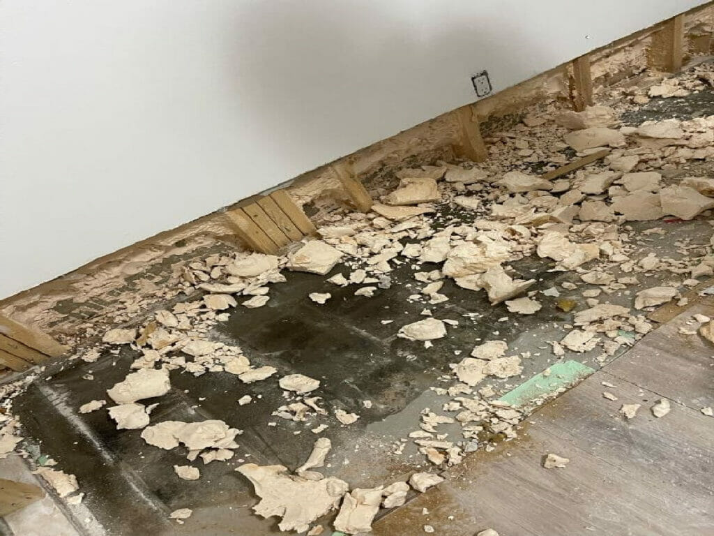 To prepare the wall for water damage restoration, all flaking, bubbling, and peeling paint was scraped off by Desa Contracting, Restoration, and Janitorial Services in Toronto