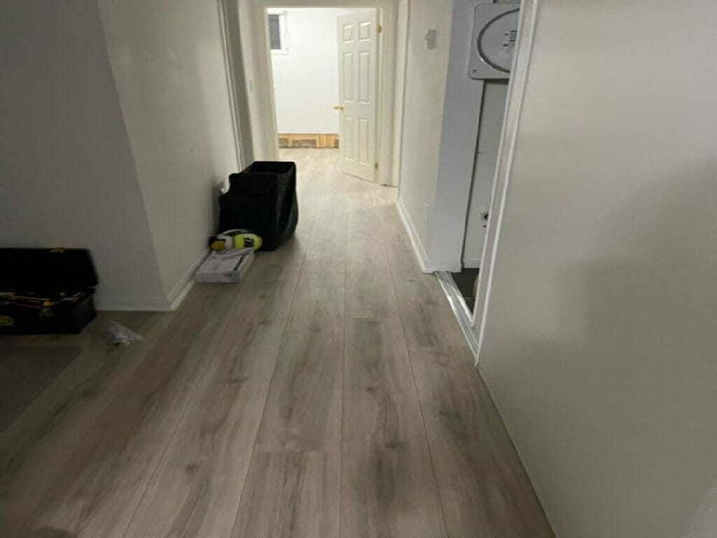 Water Damage Restoration Following A tidy room on Lawrence Avenue  West in Toronto with a tall corridor and connected rooms.